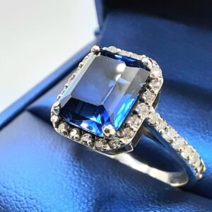 Art Deco Emerald Cut Sapphire & Diamond Halo Ring